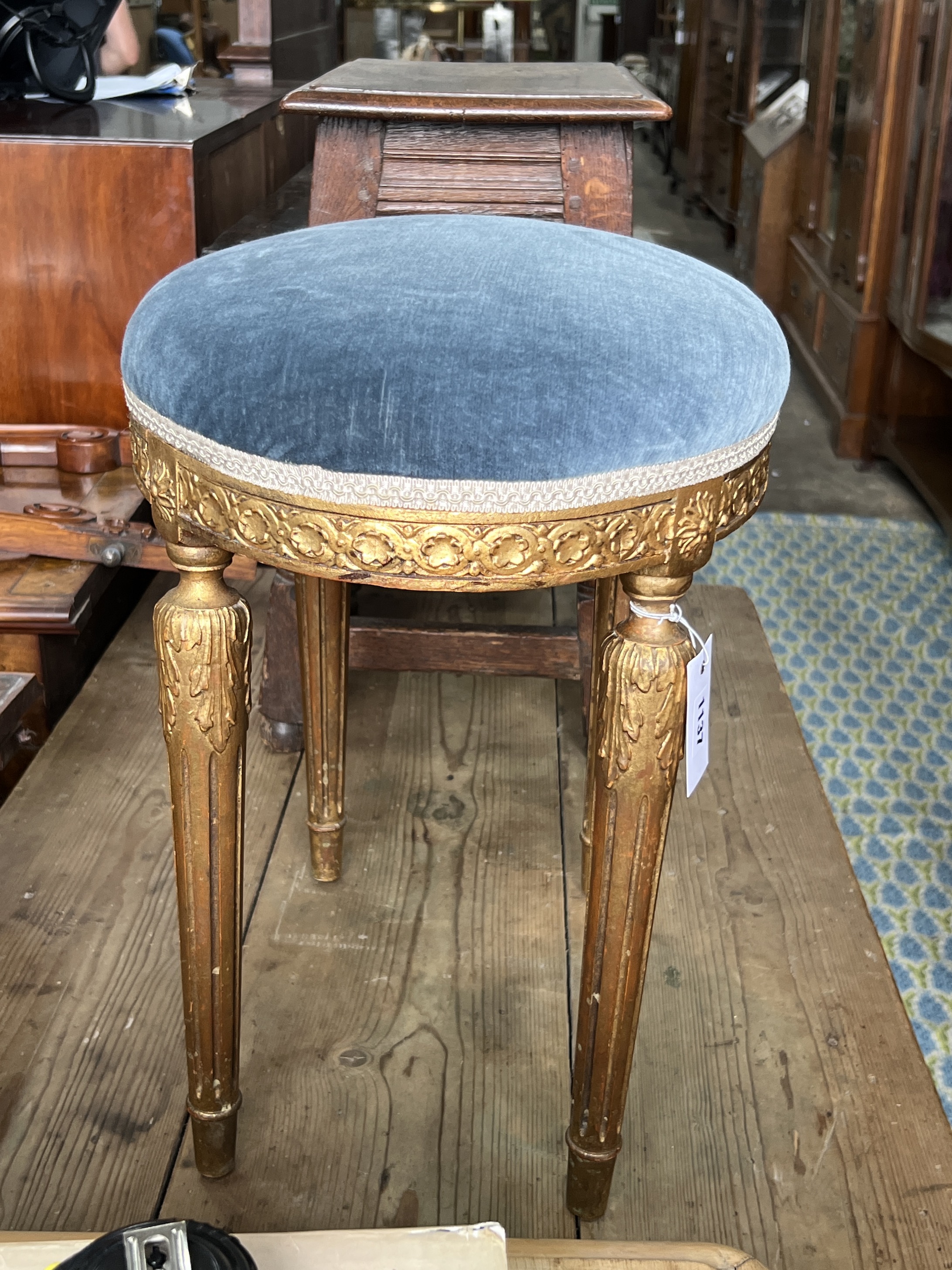 A George III style giltwood and composition oval dressing stool, width 50cm, depth 33cm, height 46cm